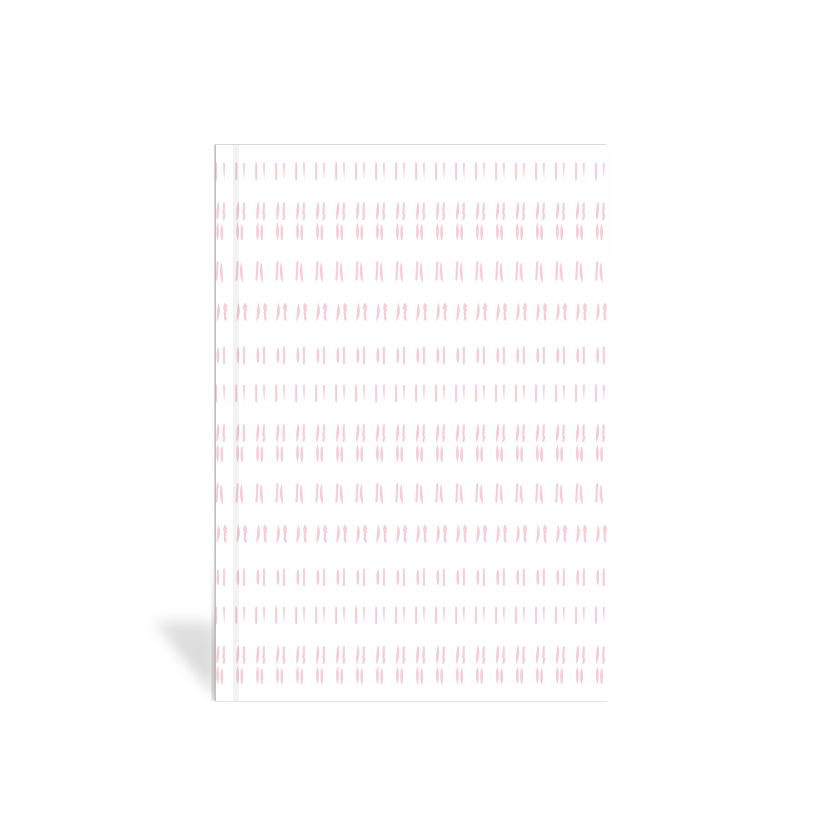 White journal with pink geometric pattern on a white background