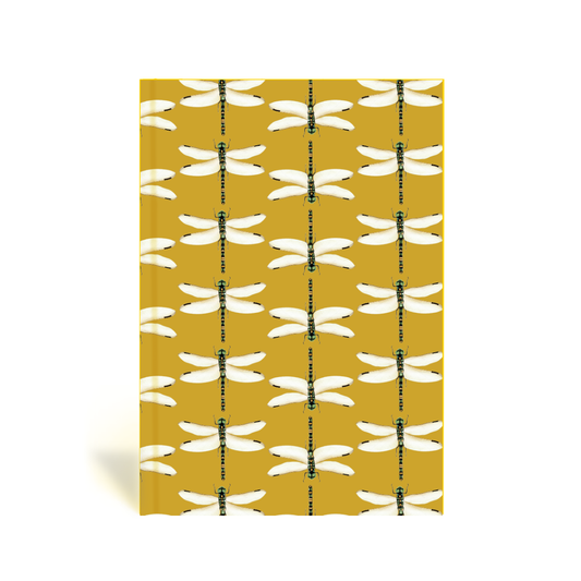 Book with dragonfly pattern on a chartreuse background