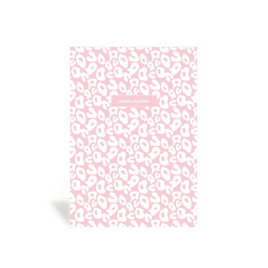 A pink leopard print planner hardbound cover.